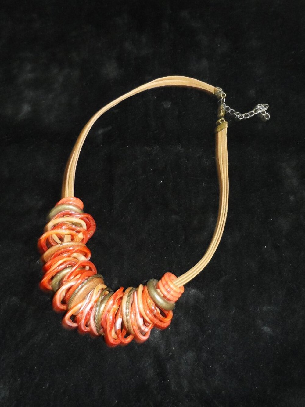 multi-strand cord necklace  orange rings made of plastic